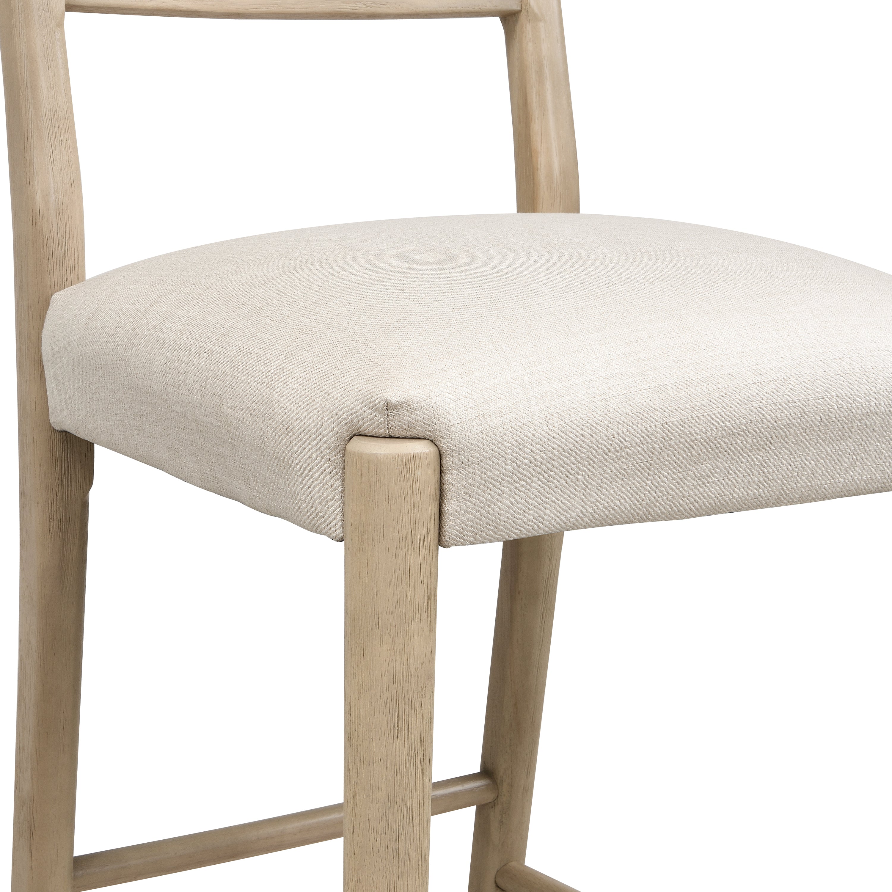 Detailed view of cushioned seat corner and wooden frame, highlighting stitching and smooth finish of the bar stool.