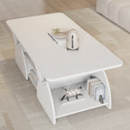 Corner view of white coffee table with open shelf and decorative items. Engineered wood build with modern storage layout.