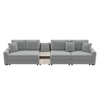 Modern grey chenille modular sectional sofa with decorative pillows and a central light wood storage console.