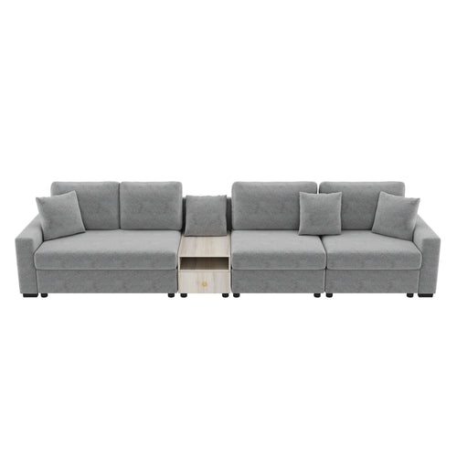 Modern grey chenille modular sectional sofa with decorative pillows and a central light wood storage console.