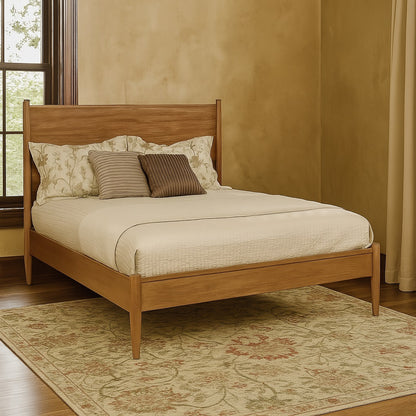 Full size Mid-Century Modern oak platform bed placed in a cozy bedroom with floral rug, showcasing its sleek wood frame and minimalist design.