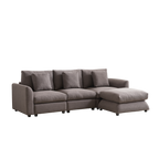 Angled view of modular sofa with ottoman in gray upholstery, designed for comfort and easy assembly in contemporary living spaces.