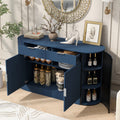 Modern MDF storage cabinet with curved doors and shelves in navy blue, styled in a living room with decor and open compartments.