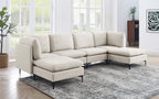 Beige linen modular sectional sofa with dual chaises and black metal legs in a bright, modern living room.