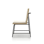 Side profile of Oak Beige Dining Chair highlighting its slim black metal legs and ergonomic backrest with wood and fabric finish.