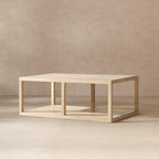 Rectangular coffee table in light natural reclaimed pine with an open-frame design and a lower storage shelf.
