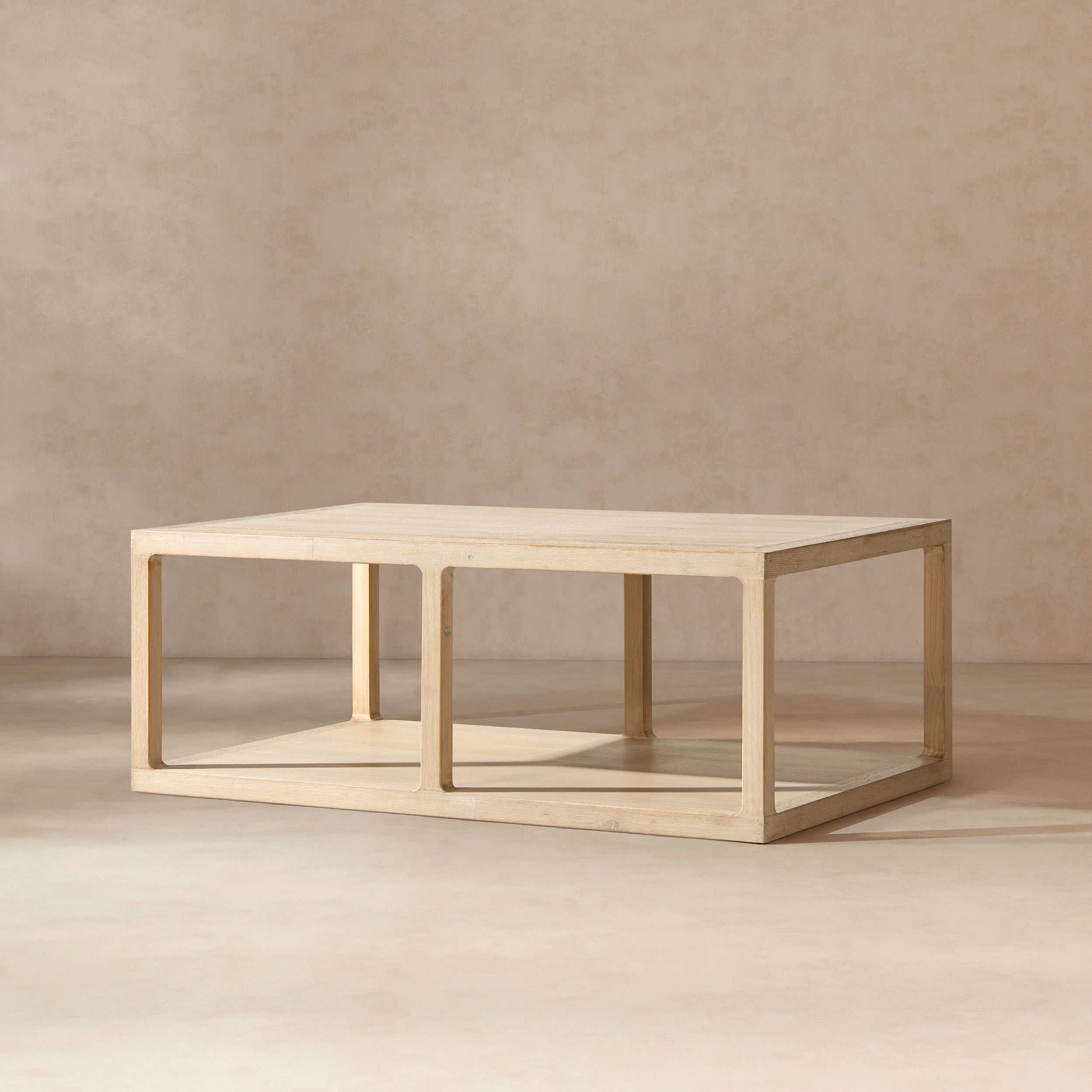 Rectangular coffee table in light natural reclaimed pine with an open-frame design and a lower storage shelf.