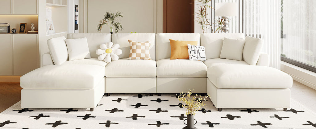 Front view of U_STYLE U-shaped sectional sofa with 2 ottomans in a cozy living room, styled with decorative pillows.