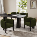 Modern dining chairs set of 4 with black rubber wood frame and olive green upholstery around a black dining table in a bright room.