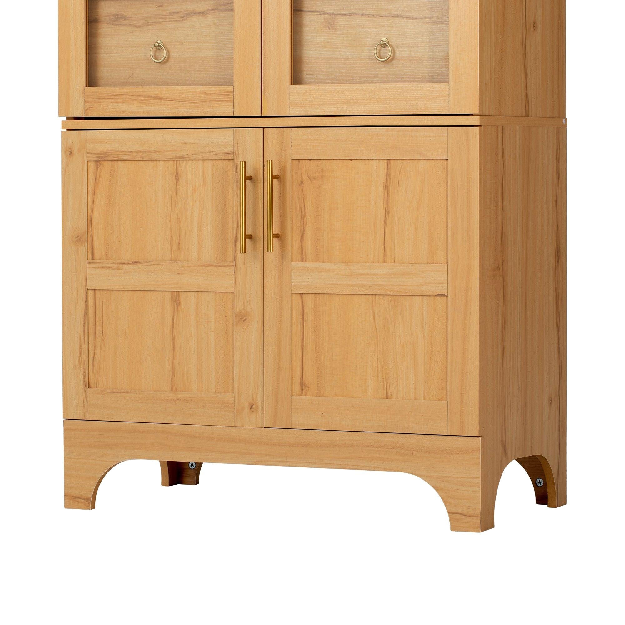 Close-up of the lower section of the arched kitchen pantry cabinet, highlighting wood panel doors and gold-tone handles.