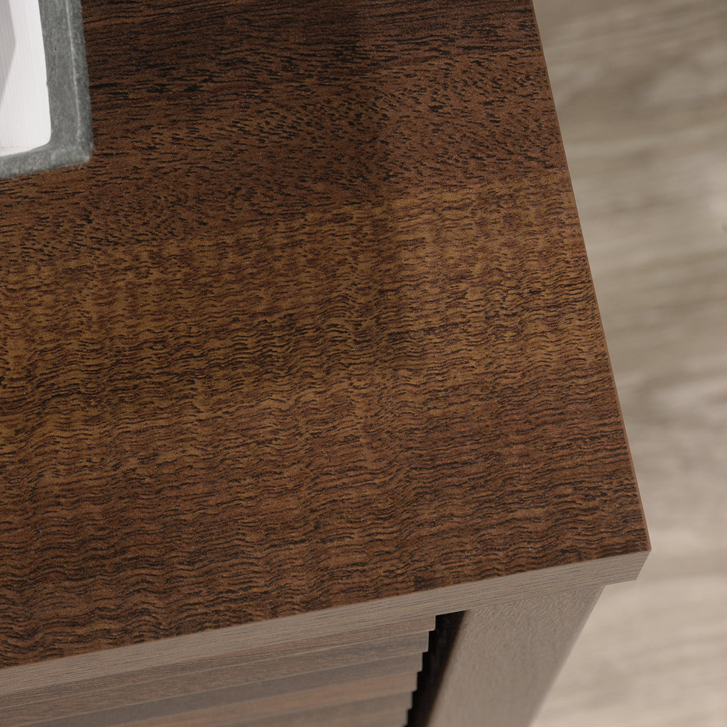 Top surface detail of the Library Base, Brown finish cabinet, showing rich wood grain texture and smooth finish.
