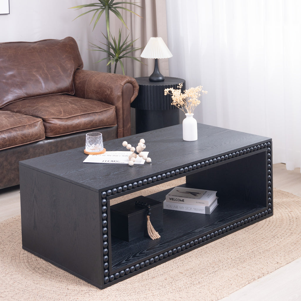 Modern Black Beaded Coffee Table styled in a living room with open storage shelf for books and decor, perfect for farmhouse aesthetics.