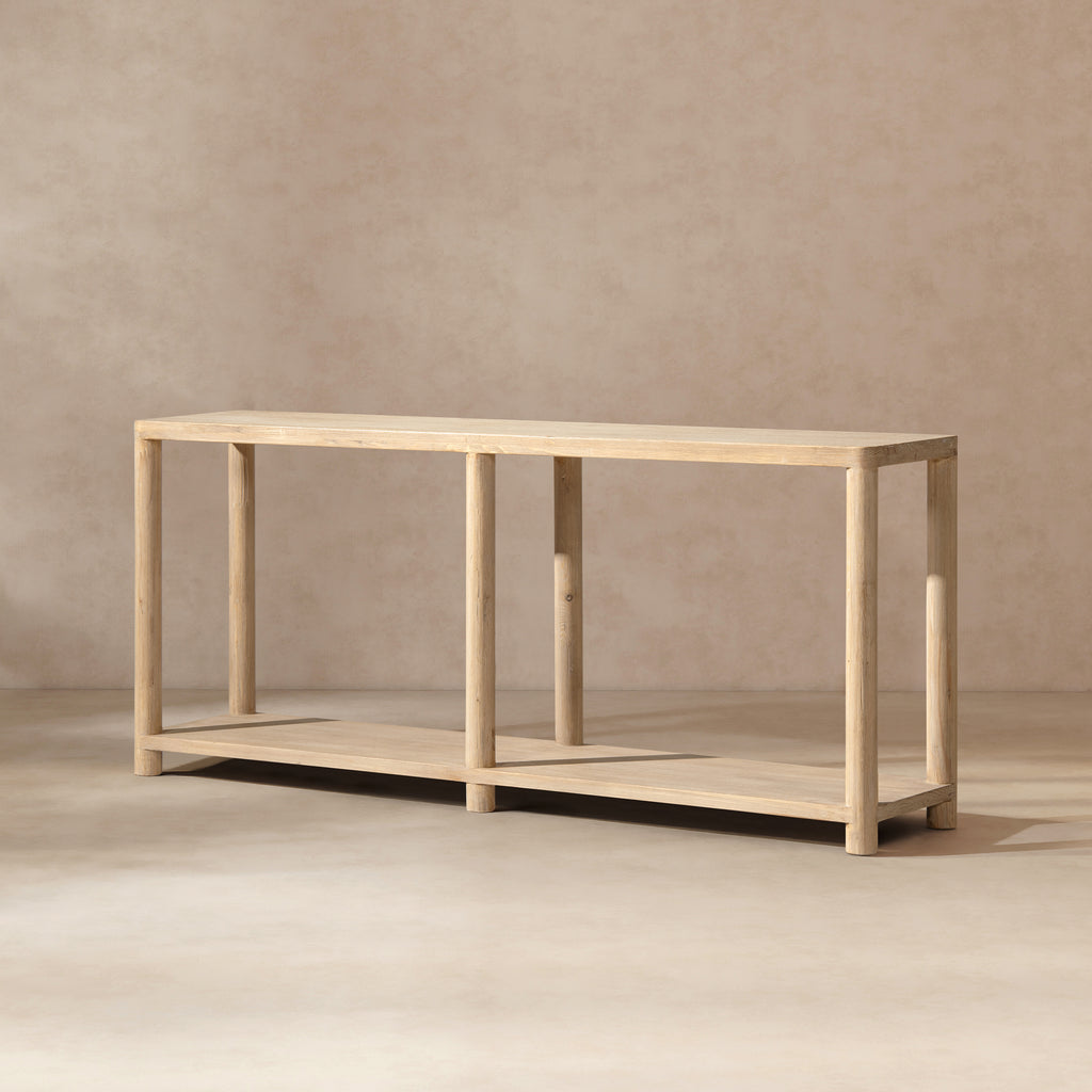 Minimalist console table in light natural cerused reclaimed pine with a long rectangular top and lower shelf.