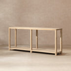 Minimalist console table in light natural cerused reclaimed pine with a long rectangular top and lower shelf.