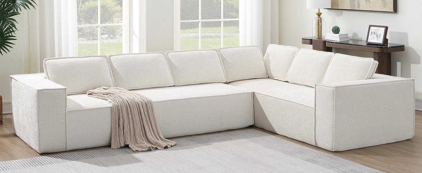 L-shaped modular sectional sofa in cream chenille fabric, styled in bright living room with throw blanket and modern decor.
