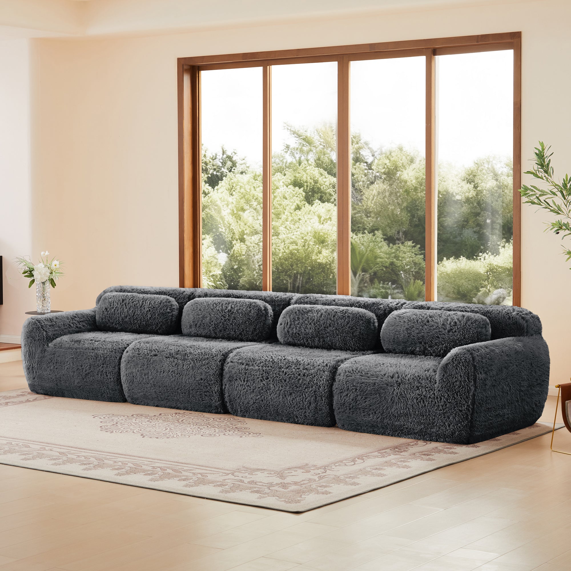 Side angle of 149'' dark grey modular plush sectional sofa showing its spacious design and cozy texture for versatile room setups.