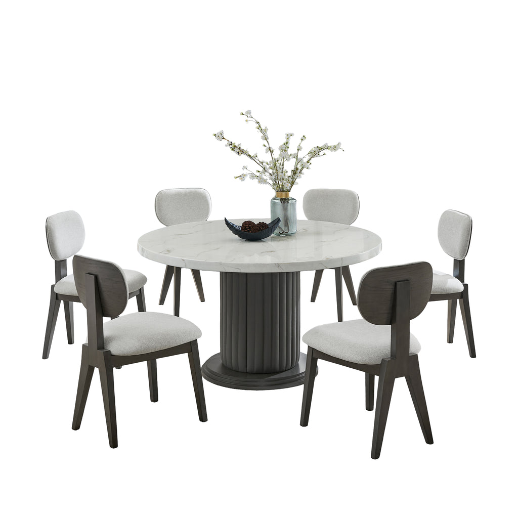 Valencia Dining Set - 7-Piece Marble featuring round faux marble table with gray pedestal base and 6 cushioned chairs in a white backdrop.