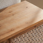 Detail of the natural wood grain on the Rattan TV Stand Mid Century with Storage, showcasing quality craftsmanship.