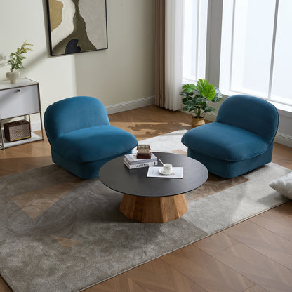 Top view of a living room featuring two teal swivel accent chairs with velvet upholstery around a wooden coffee table.
