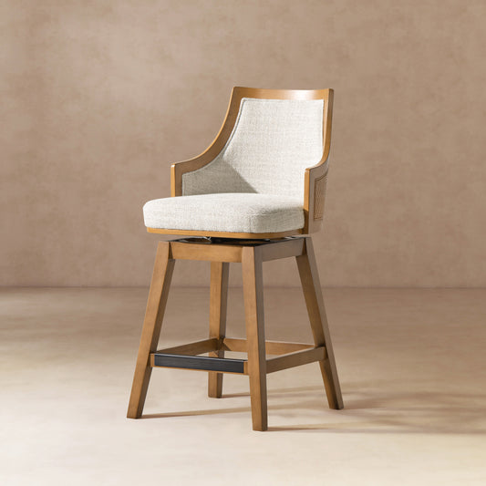 Rattan Swivel Counter Stool with Cane Back featuring a high back, recessed arms, and neutral gray upholstery, ideal for modern dining spaces.