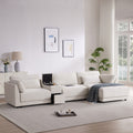L-Shaped sectional sofa with storage and charging in a modern living room, featuring a reversible console and plush cushions for ultimate comfort.