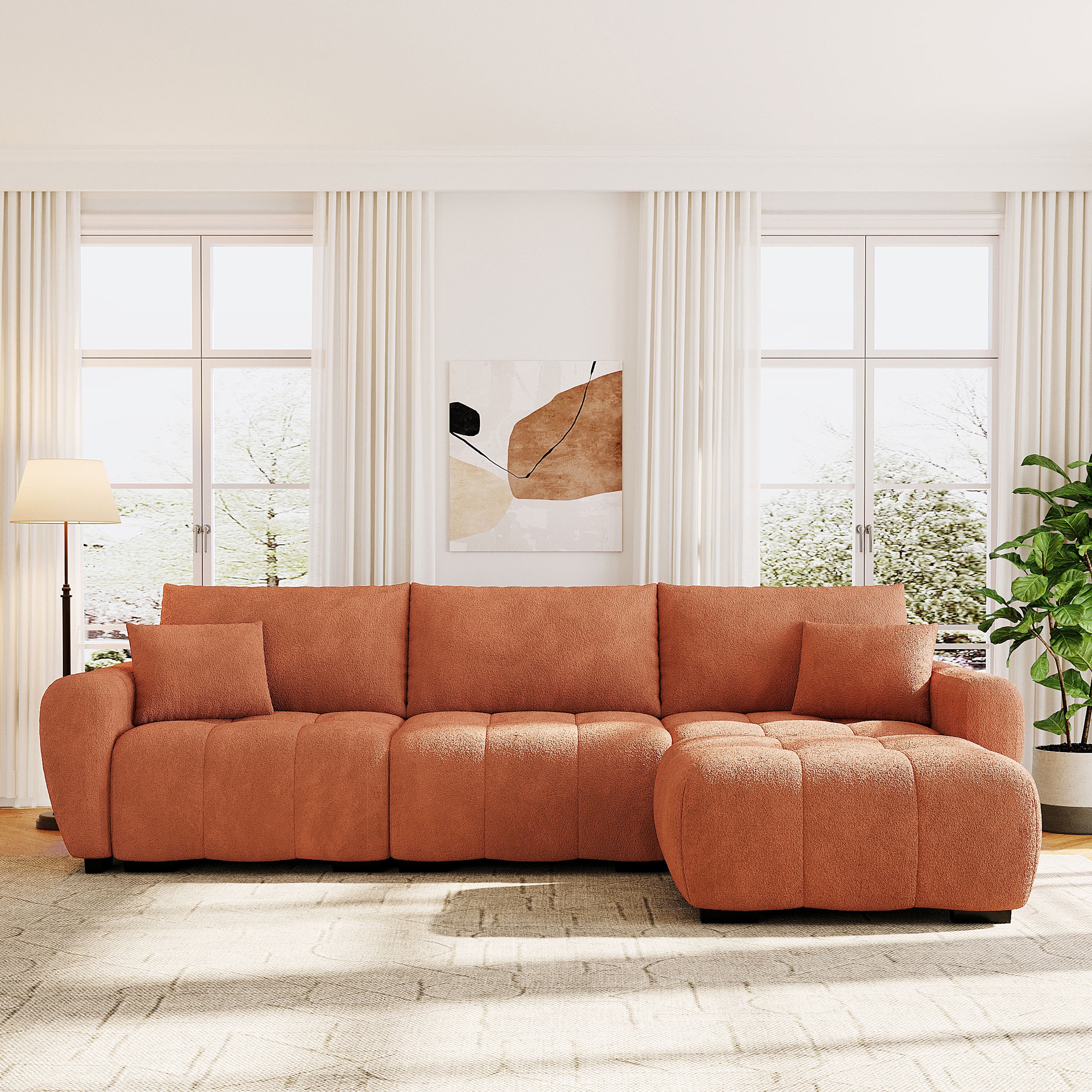 Modular sectional sofa with ottoman in boucle fabric arranged in a straight layout, ideal for spacious living rooms with natural lighting.