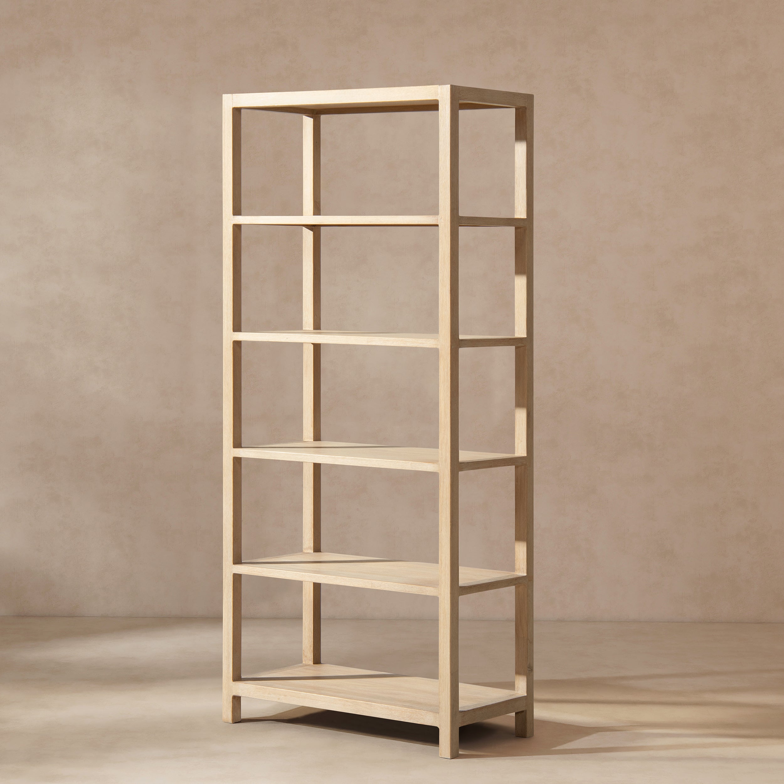 Tall, open-frame bookcase in light natural cerused pine with five shelves in a clean, minimalist wood design.