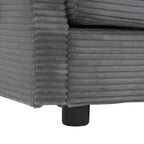 Corner detail of modular sofa base with ribbed corduroy fabric and black leg support for a sturdy, modern design.