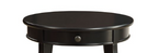 Close-up of Alysa Black Accent Table's round tabletop and drawer with knob, showcasing its smooth black wood finish and classic style.