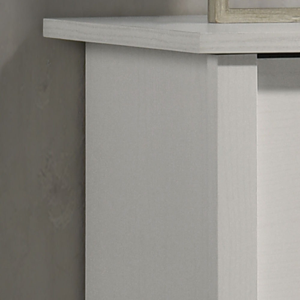 Close-up of top corner of Celeste Chest - White 4-Drawer Chest. Highlights smooth surface and precise craftsmanship.