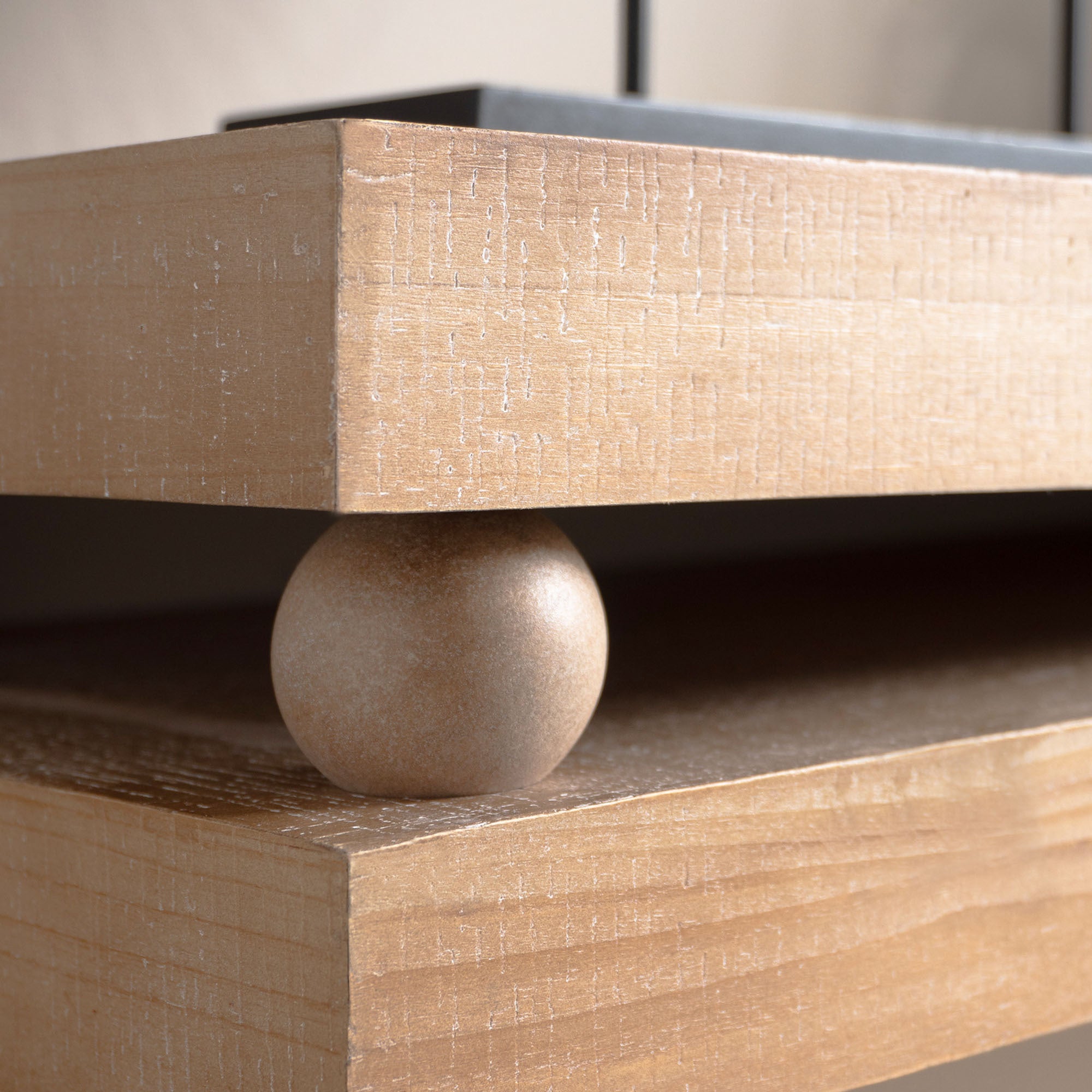 Detail of bead accent between tabletop layers on the Slim Natural Wood Console Table, showcasing its unique design element.
