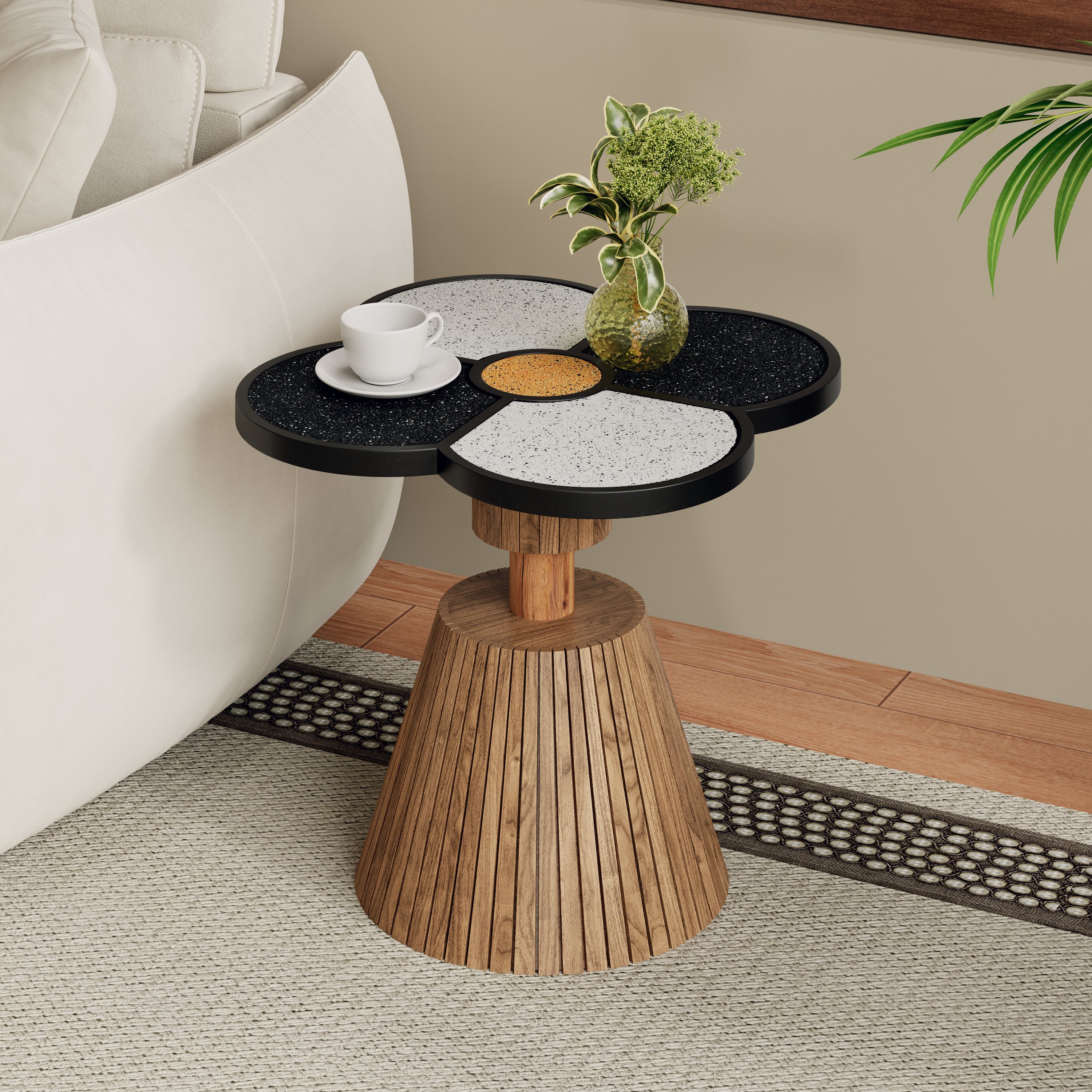 Four-Leaf Clover Accent Table with terrazzo top and wood-grain base beside a white sofa in a modern living room setting.