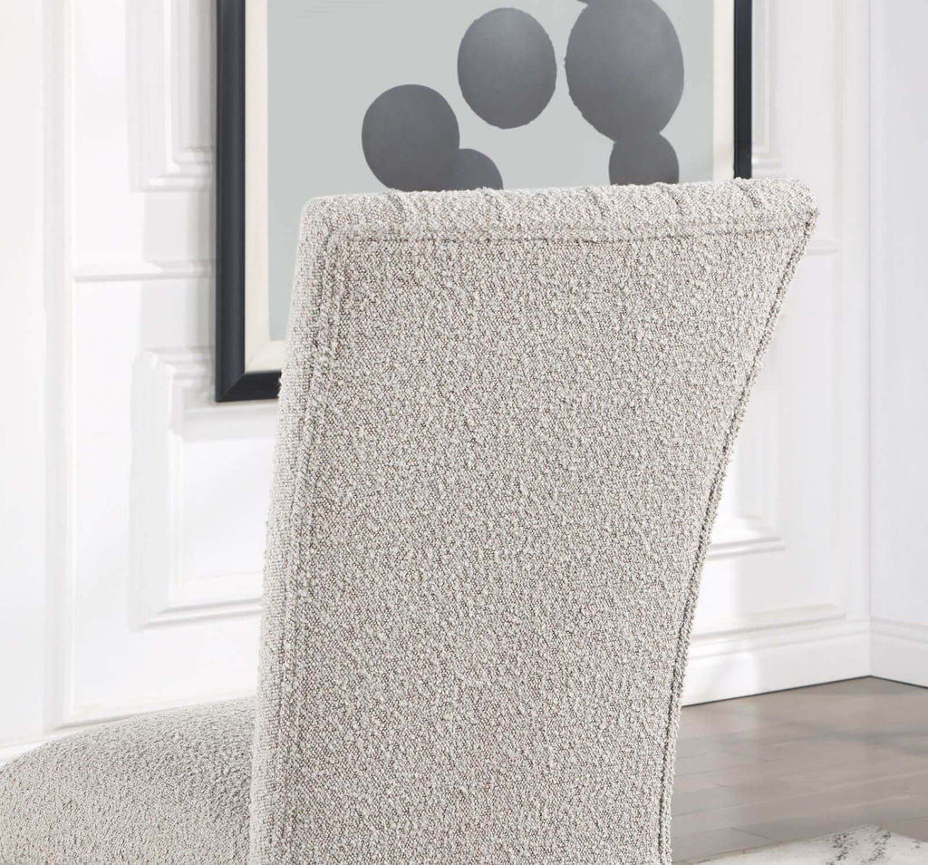 Backrest detail of gray boucle dining chair with curved design, part of the Genuine Marble Dining Table Set.
