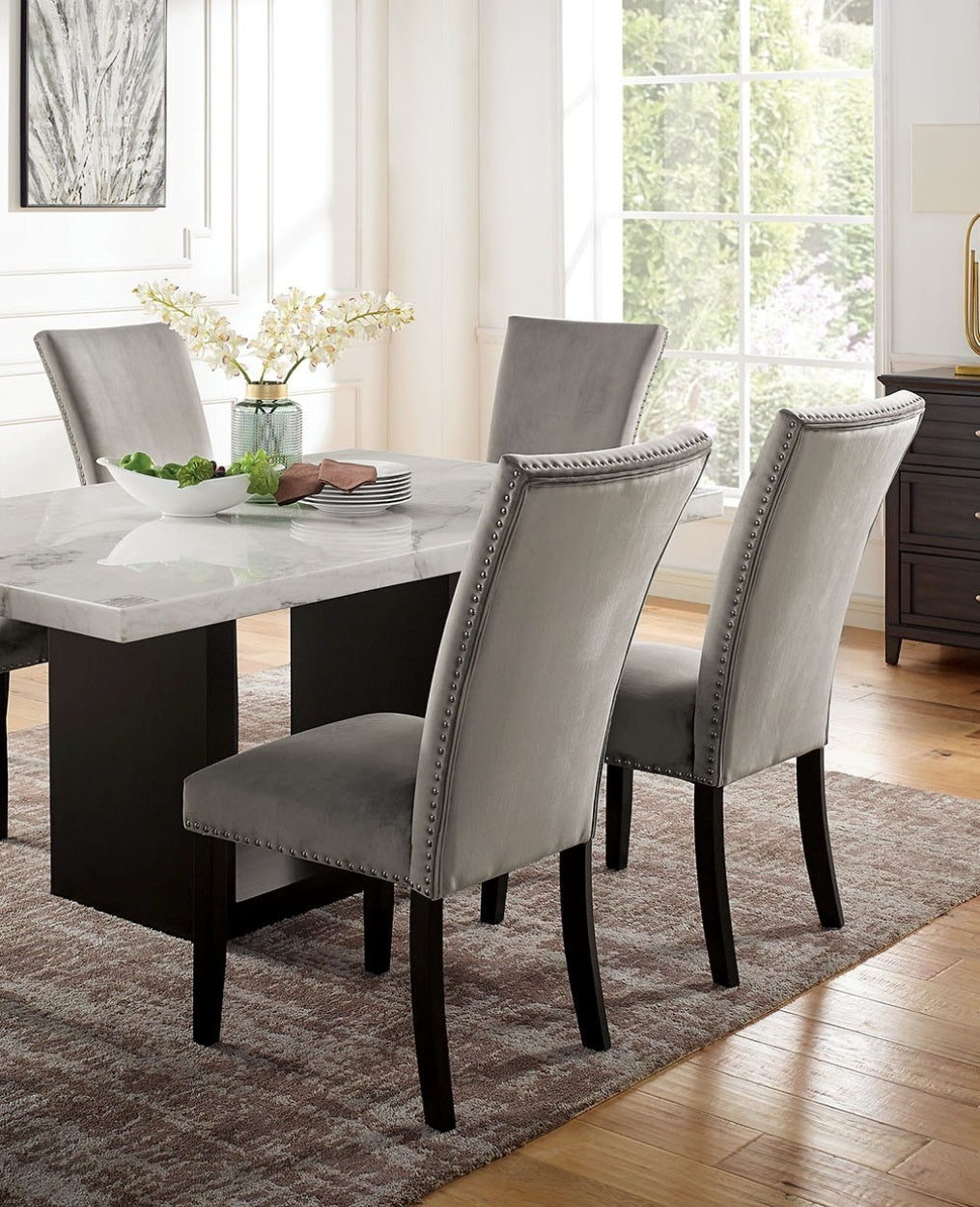 Angled view of 7pc marble dining table set with six grey chairs and genuine marble top. Adds luxury to any dining area.