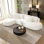 L-Shape Sectional Sofa Beige placed in a modern living room with black round coffee table and neutral decor, highlighting its oversized comfort.