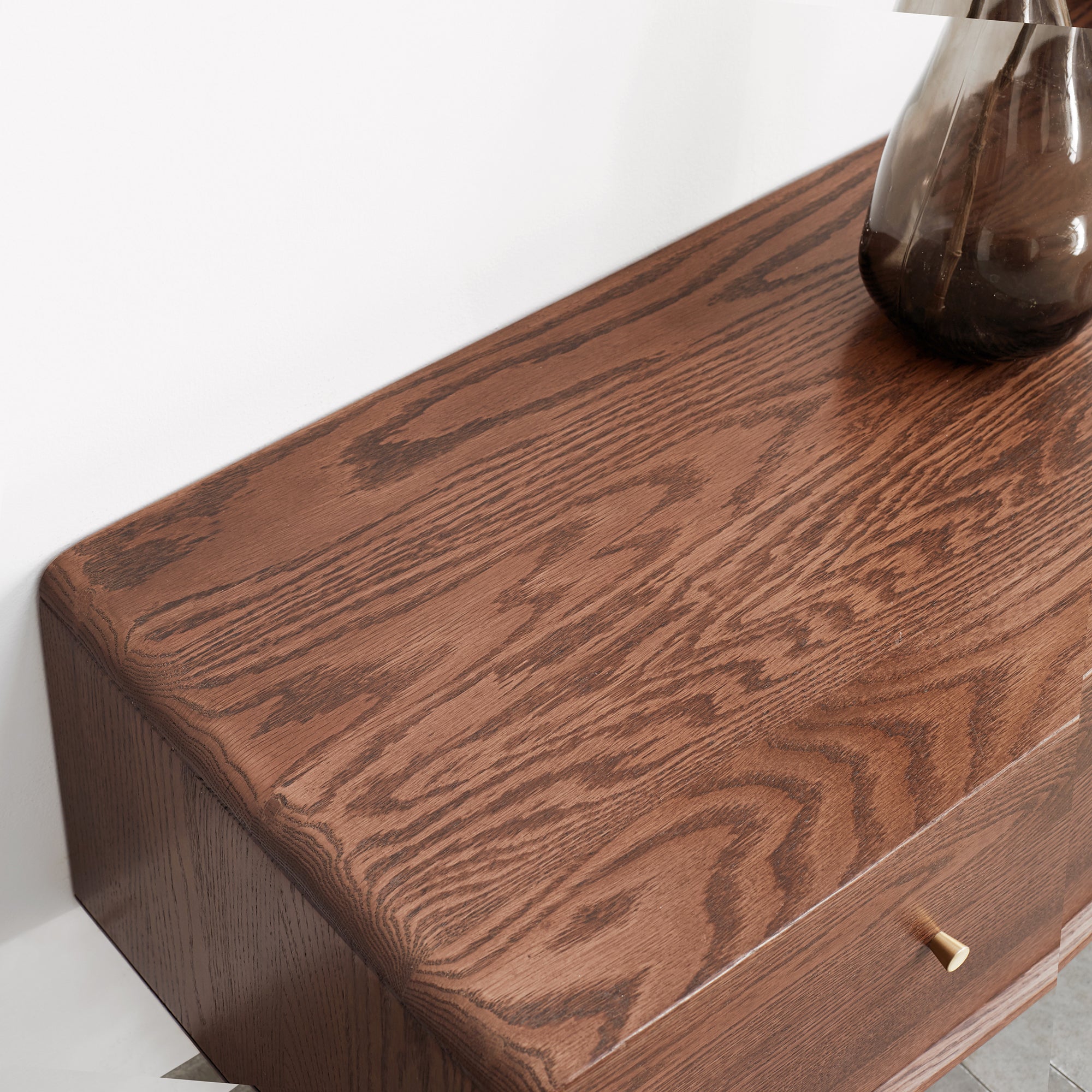 Close-up of solid red oak wood grain on TV cabinet surface. Durable finish enhances natural texture, ideal for premium furniture buyers.