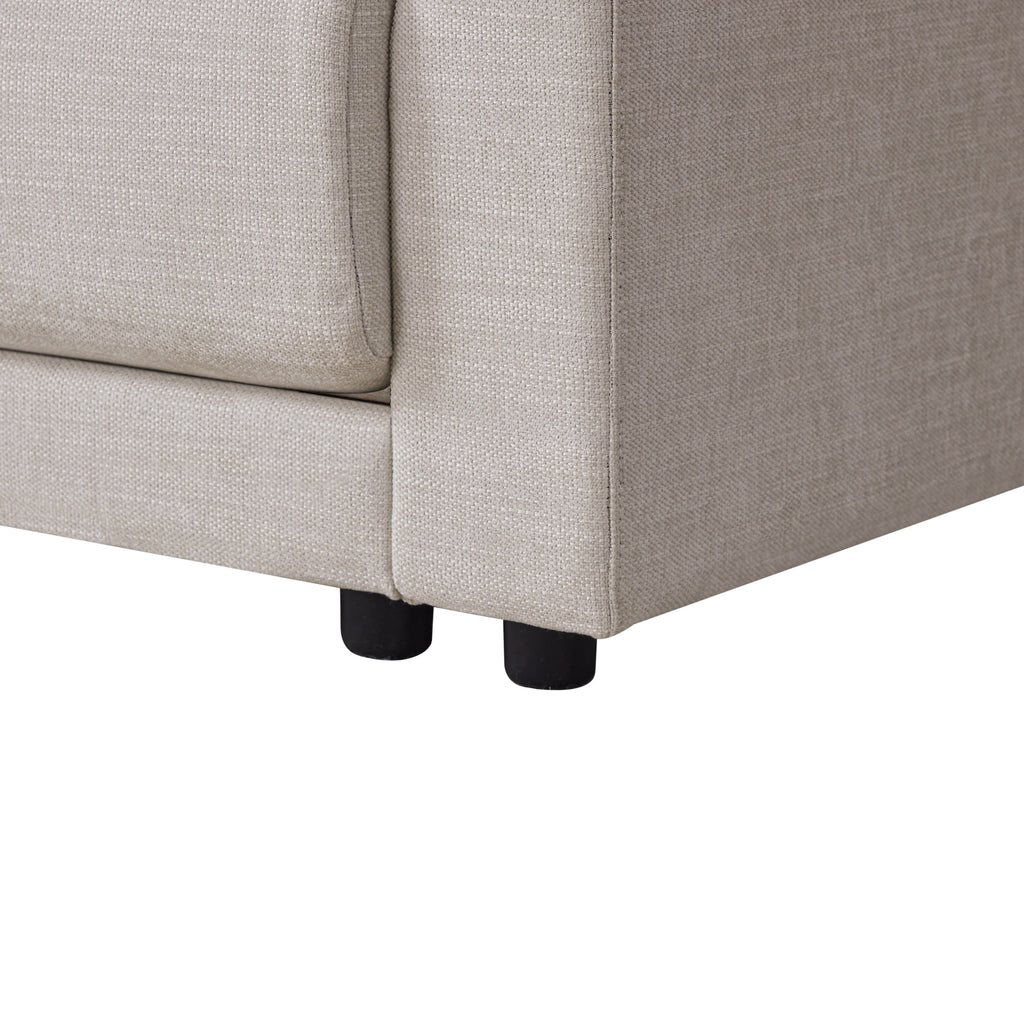 Detail of L-Shaped sectional sofa’s sturdy base and short black legs, showcasing its durable construction and modern design.