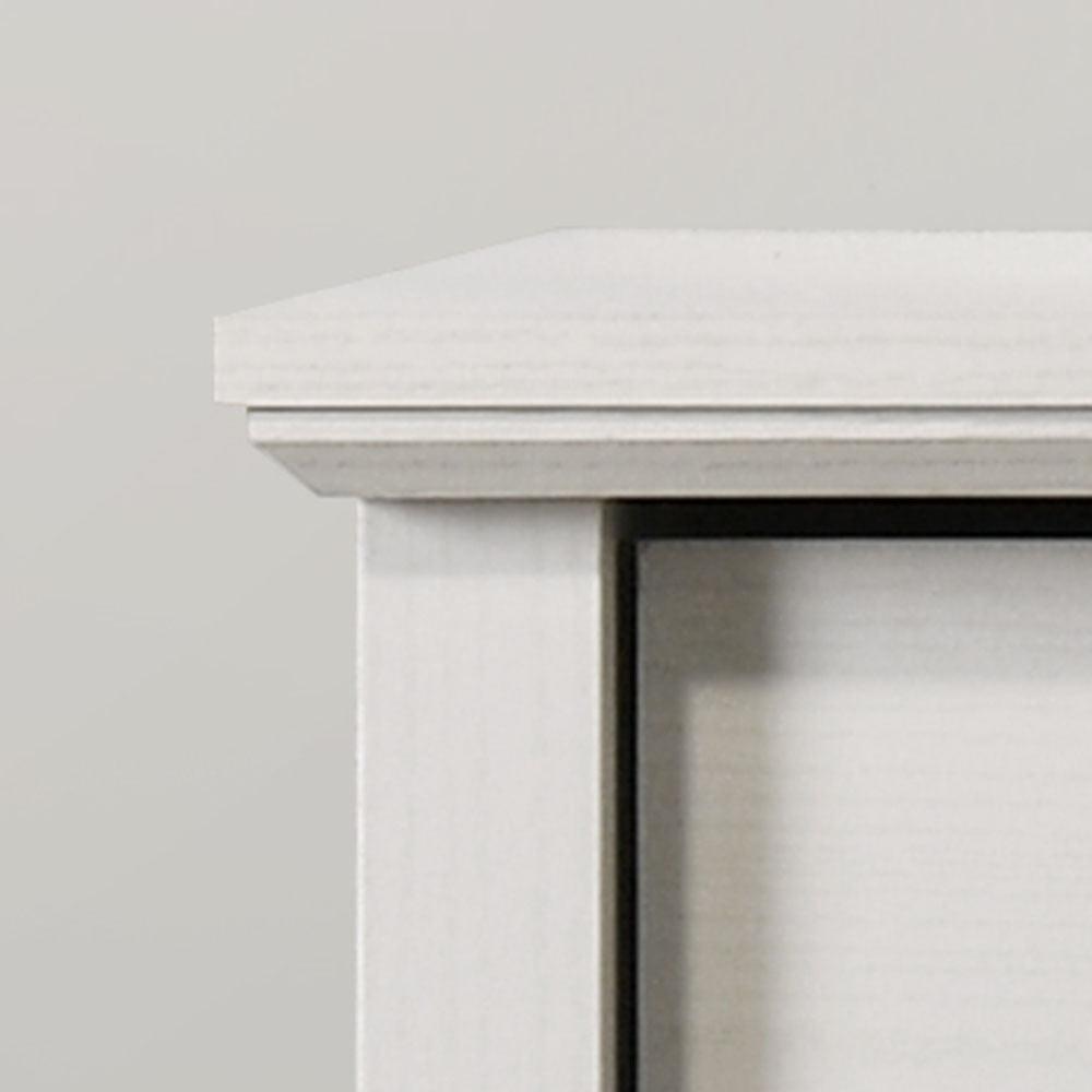 Elara White 4-Drawer Chest with Black Metal Handles.