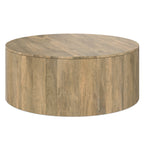 Angled side view of the Millbury Drum Coffee Table in wood, highlighting its spacious round surface and multi-functional drum style.