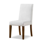 Single rustic dining chair with white upholstery and brown wood legs, perfect for modern farmhouse or rustic dining room decor.