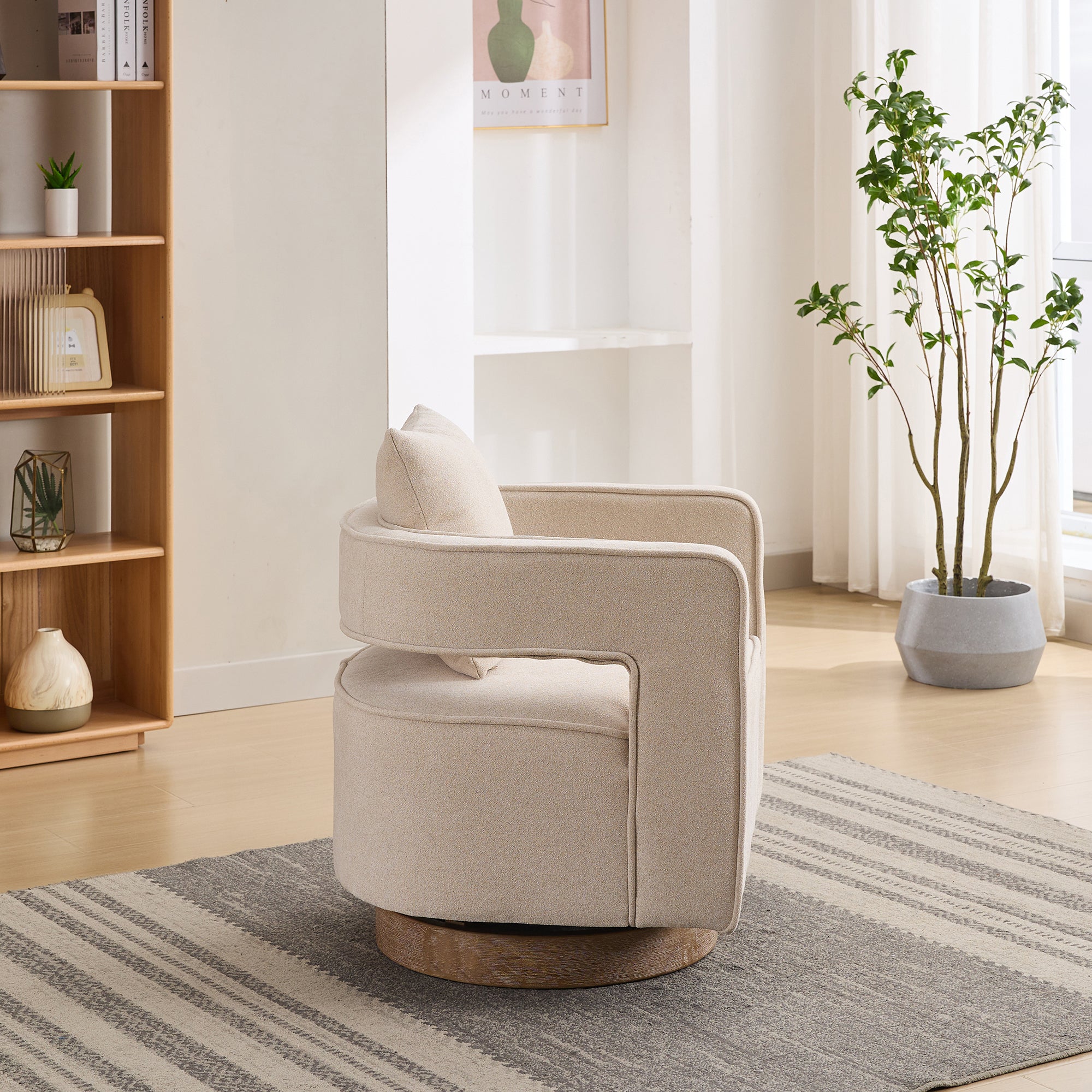 Side profile of linen swivel accent chair with curved open back and 360° rotation, supported by a weathered wood base.