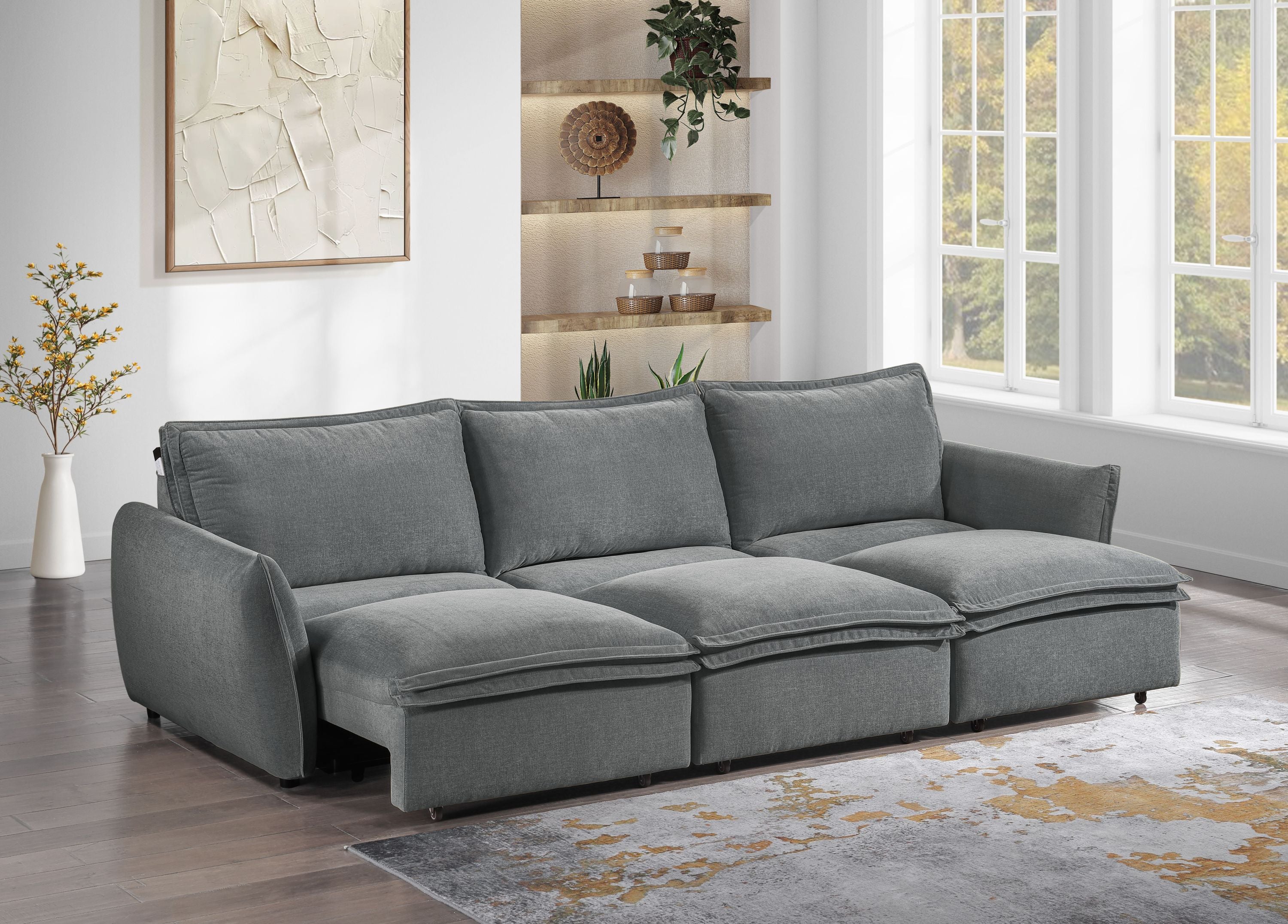 Gray Chenille Sleeper Sofa - Eaden Power Sofa in modern living room with large windows, offering plush seating and stylish comfort.