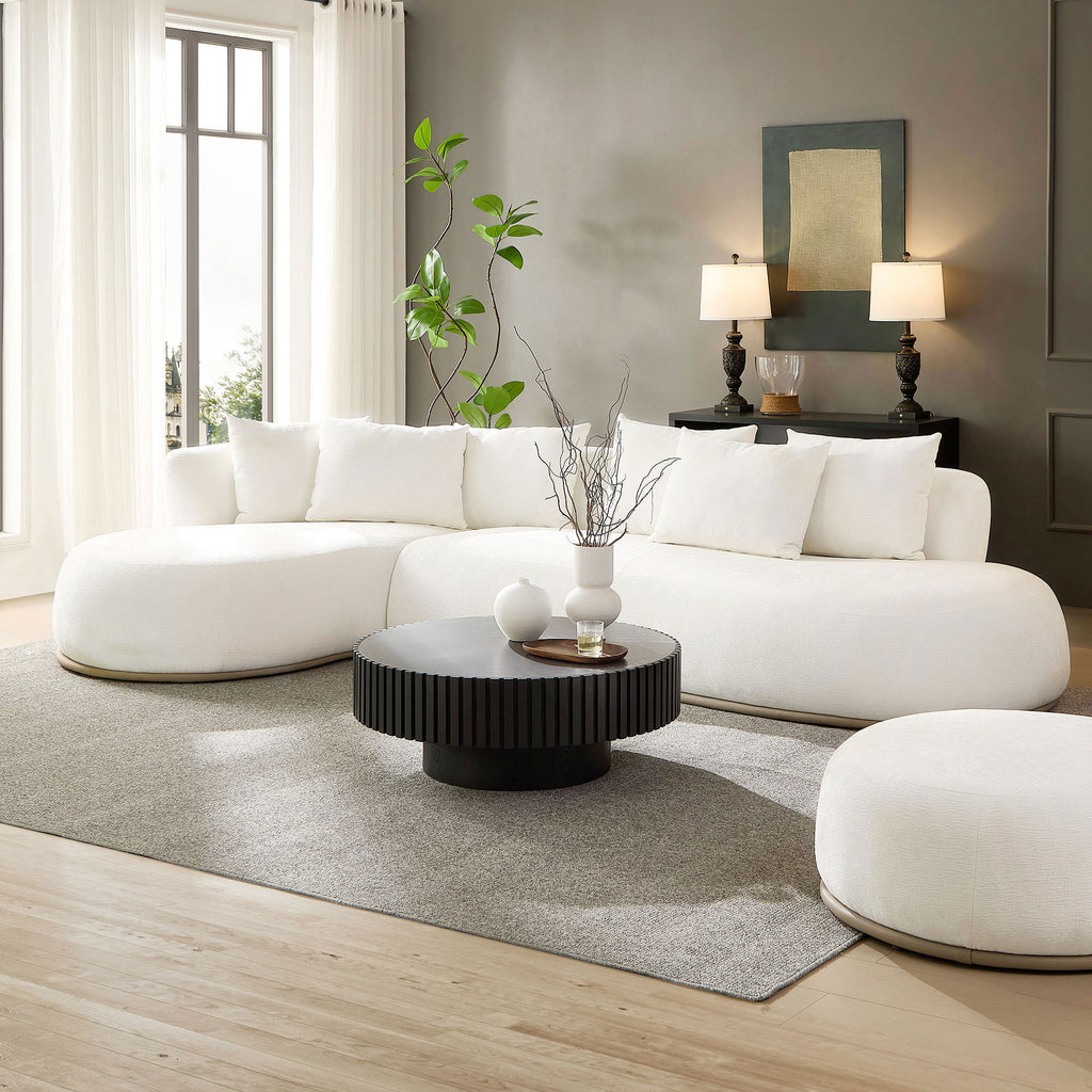 L-Shape Sectional Sofa Beige - Oversized Couch with chaise in a modern living room, featuring plush cushions and a round black coffee table.