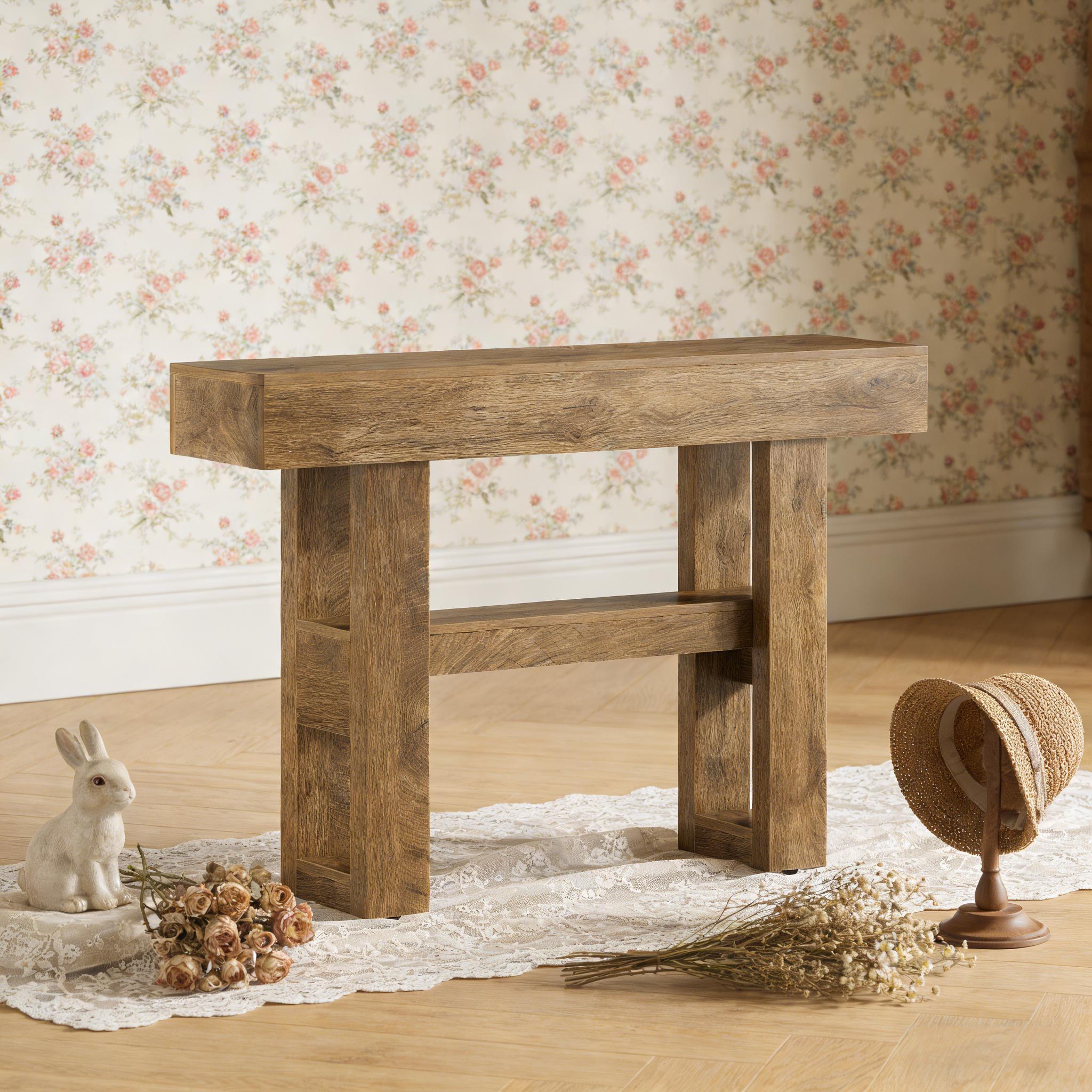 Rustic brown wooden console table with a thick top, sturdy block legs, and a lower support shelf.