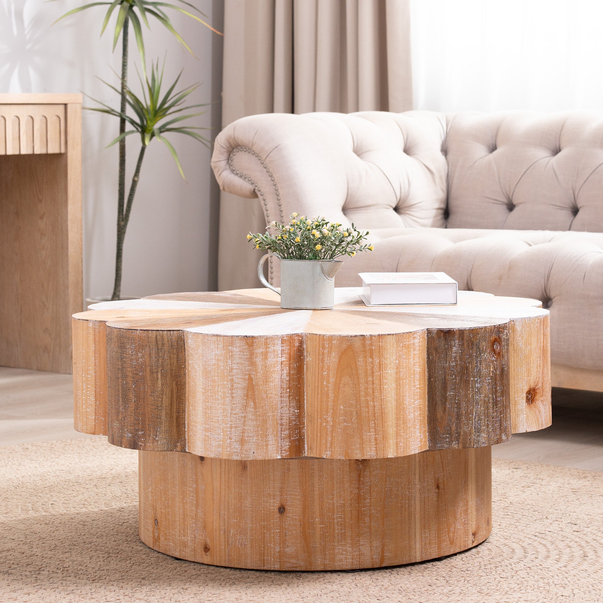 Vintage distressed flower-shaped coffee table styled in a bright living room, enhancing rustic and natural interior themes.