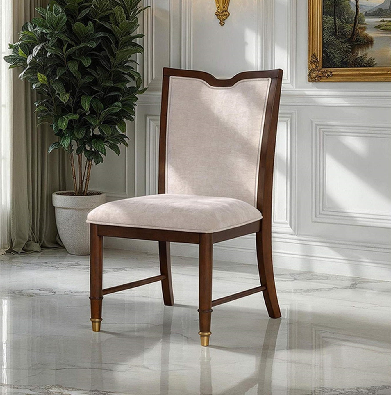 Transitional dining chair with upholstered seat and backrest, solid wood frame, and gold-capped legs in a classic interior setting.