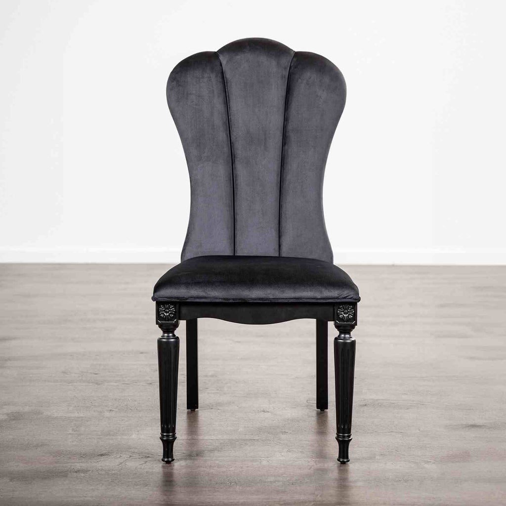 Black dining room side chair with fluted legs and high upholstered backrest, ideal for elegant dining spaces.