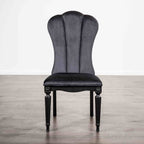 Black dining room side chair with fluted legs and high upholstered backrest, ideal for elegant dining spaces.