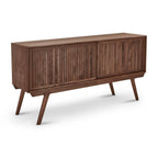 Mid-century modern media console in solid walnut with sliding slatted doors and tapered legs against a white background.