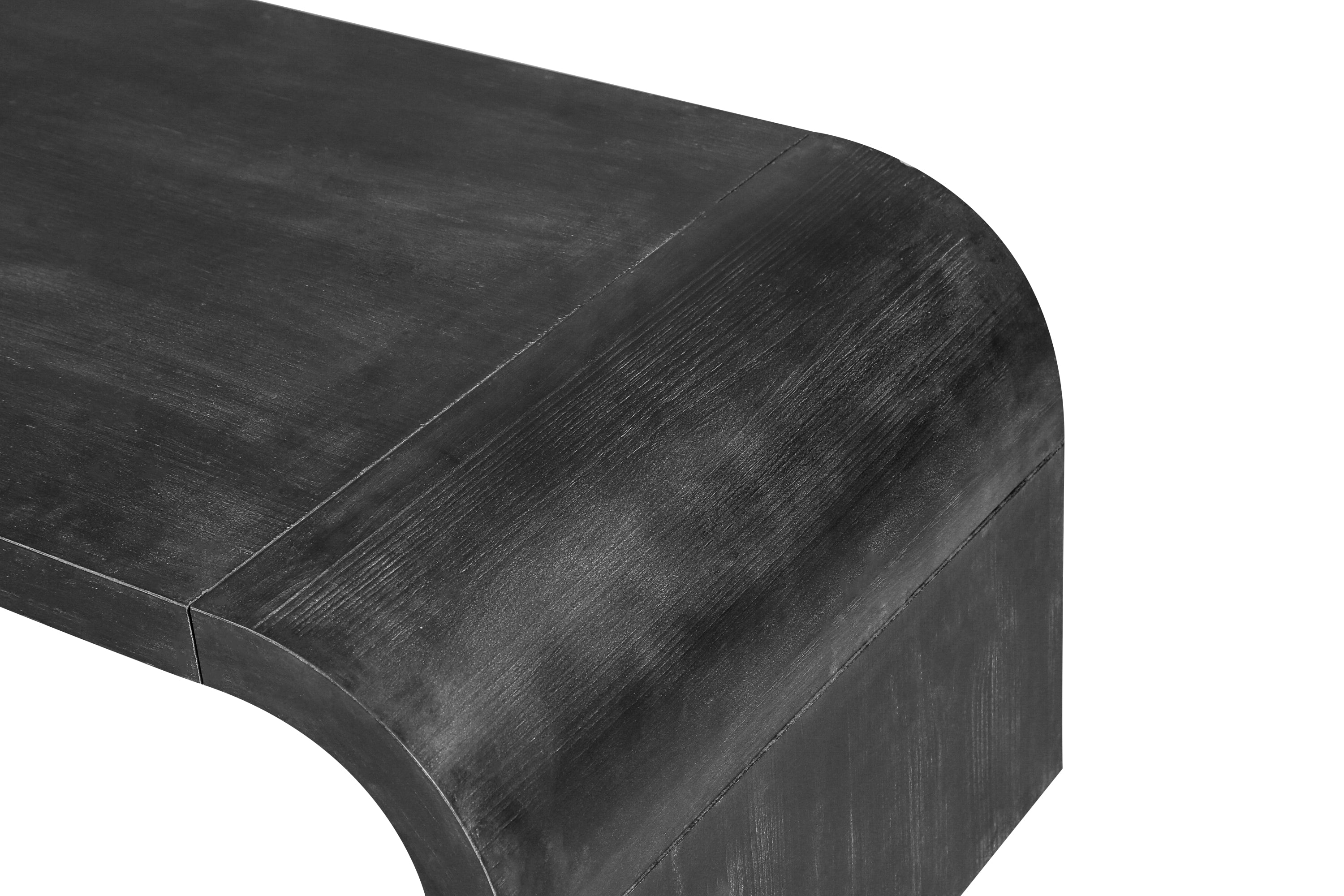 Detail of the curved corner and wood grain texture on the Vintage Farmhouse Coffee Table, emphasizing craftsmanship and finish.
